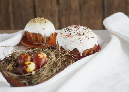 Easter. Traditional Easter pastries, eggs painted in onion peel and imitation of chicken nests with...