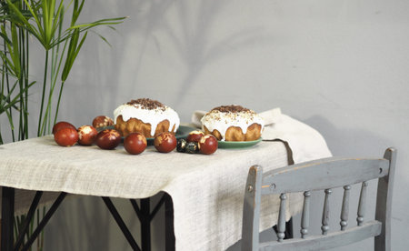 Easter baking with Easter eggs dyed with onion husks with imprints of fresh leaves, on a fabric...