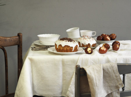 Easter baking with Easter eggs dyed with onion husks with imprints of fresh leaves, on a fabric...