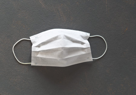 Coronavirus, quarantine, pandemic 2020. Medical protective breathing mask on the face to protect...