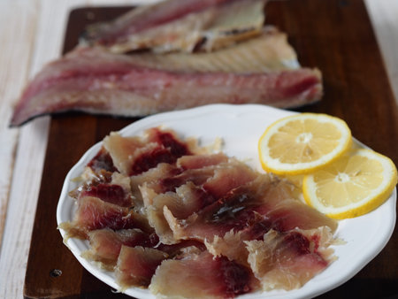 Fish background. Balyk pieces from freshly salted Russian river fish on the background of fish...