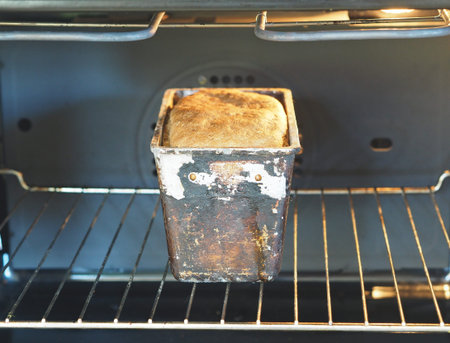 Homemade cake. Rye bread is baked in a form in the kitchen oven. Healthy diet.