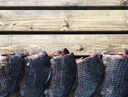 Russian river fish.Sliced dried salted fish, which is usually called balyk, without the head and intestines, lies on a wooden grate for ventilation.の写真素材