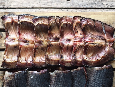 Russian river fish. Sliced dried salted fish, which is usually called balyk, without the head and...