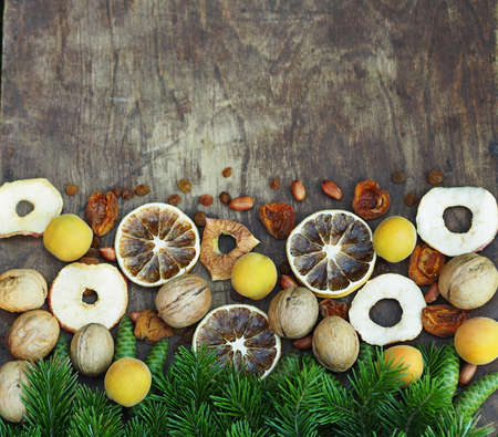 Happy New Happy full harvest year 2021. Branches of a Christmas tree are laid out on a wooden background. Christmas background.の写真素材