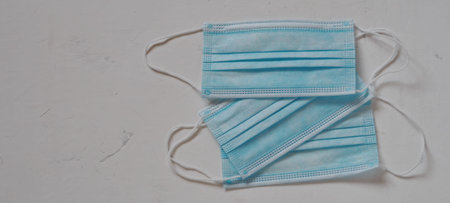 Medical blue protective masks on a white background. Observe the mask mode.
