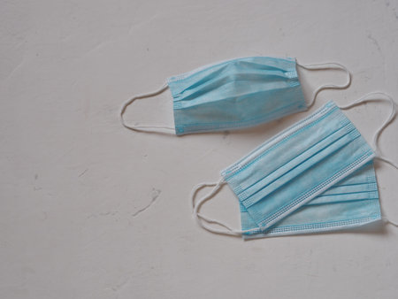 Medical blue protective masks on a white background. Observe the mask mode.