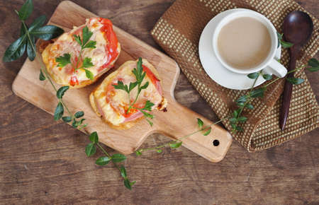 Hot sandwiches with a cup of coffee on a wooden table.Healthy natural food. Home cooking.の写真素材