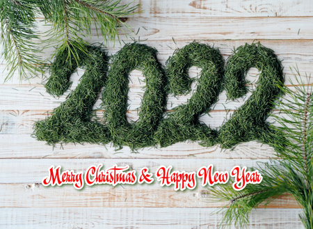 Happy New Year 2022, New Year is numbers are made of natural Christmas tree needles. Congratulatory...