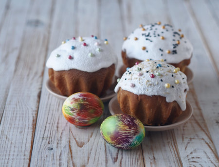 Sweet muffins, with cream and festive sprinkles, baked for the Orthodox Christian holiday of Easter...