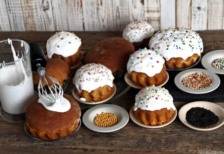 Pre-holiday chores. Homemade Easter pastries with festive sprinkles for baking are displayed on a...