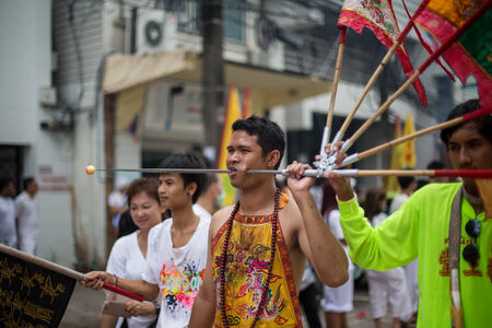 PHUKET, THAILAND - SEPTEMBER 30: Unidentified Mah song pierced weapon to their cheeks, They believed...