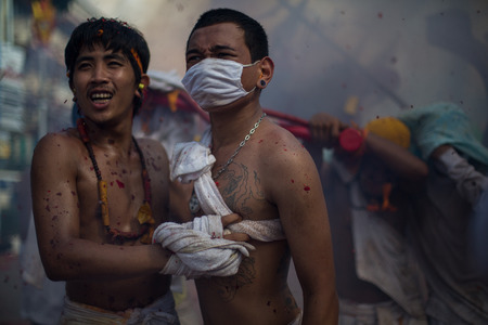 PHUKET, THAILAND ? October 1:Taoist devotees participate in a street procession of the Nine Emperor Gods Festival, known locally as the Phuket Vegetarian Festival on the 1 October, 2014. in Phuket Town, Phuket, Thailand.のeditorial素材