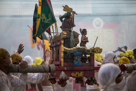 PHUKET, THAILAND - SEPTEMBER 30:Taoist devotees participate in a street procession of the Nine...