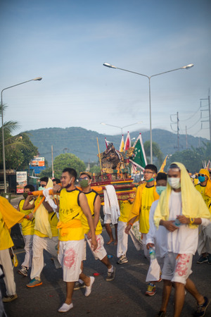PHUKET, THAILAND ? October 1:Taoist devotees participate in a street procession of the Nine Emperor Gods Festival, known locally as the Phuket Vegetarian Festival on the 1 October, 2014. in Phuket Town, Phuket, Thailand.のeditorial素材
