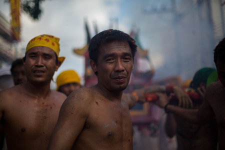 PHUKET, THAILAND ? October 1:Taoist devotees participate in a street procession of the Nine Emperor Gods Festival, known locally as the Phuket Vegetarian Festival on the 1 October, 2014. in Phuket Town, Phuket, Thailand.のeditorial素材