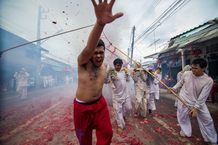 PHUKET, THAILAND ? October 1:Taoist devotees participate in a street procession of the Nine Emperor Gods Festival, known locally as the Phuket Vegetarian Festival on the 1 October, 2014. in Phuket Town, Phuket, Thailand.のeditorial素材