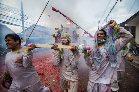 PHUKET, THAILAND ? October 1:Taoist devotees participate in a street procession of the Nine Emperor Gods Festival, known locally as the Phuket Vegetarian Festival on the 1 October, 2014. in Phuket Town, Phuket, Thailand.のeditorial素材