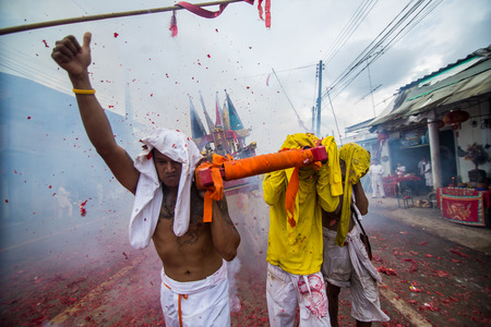 PHUKET, THAILAND ? October 1:Taoist devotees participate in a street procession of the Nine Emperor Gods Festival, known locally as the Phuket Vegetarian Festival on the 1 October, 2014. in Phuket Town, Phuket, Thailand.のeditorial素材