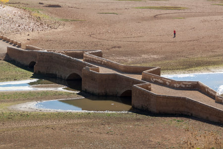 Drought in the Linares reservoir. Bridge of Maderuelo in Segovia, Castilla y Leon. Spainの写真素材