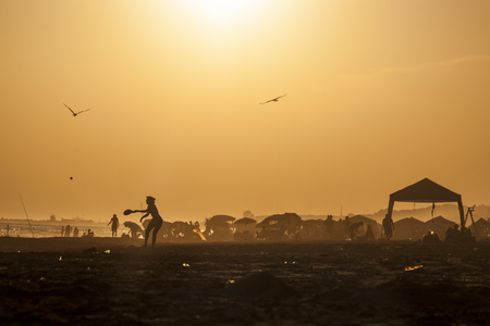 Sunset on the beach, people silhouette in Mazagon, Huelva, Andalusia, Atlantic coast, Spainの写真素材