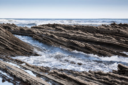 Geological rock formations and cliffs on the Flysch route. Cantabrian Sea. In Vizcaya, Basque...