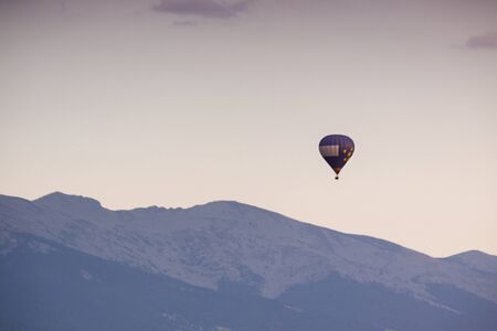 Aerostatic balloon festival over the city of Segovia, Castilla y LeÃ³n. Spain. Adventures with friends and family, flights. Flying at sunrise in a balloonの写真素材