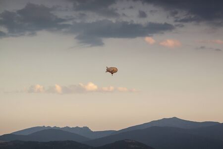 Aerostatic balloon festival over the city of Segovia, Castilla y LeÃ³n. Spain. Adventures with friends and family, flights. Flying at sunrise in a balloonの写真素材