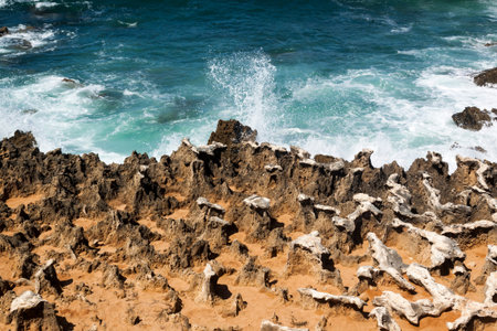 Fishermen's route in the Alentejo, promenade with cliffs in Portugal. Wooden walkway along the...