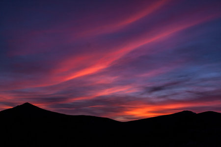 Spectacular sunset at the top of the mountain. In the Sierra de Guadarrama National Park, Segovia,...