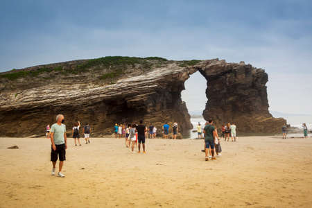Ribadeo, Lugo, Galicia - July 23, 2020: Beach of the Cathedrals. Low tide in summer with tourists during the Covid-19 pandemicのeditorial素材