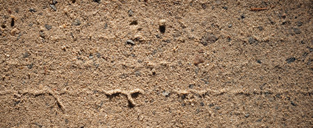 Sand texture photography. Dirt road, graphic resources and wallpaper. Close up image on natural soil