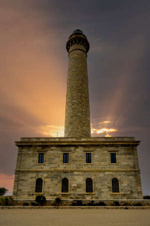 Cabo de Palos lighthouse at sunset, in Cartagena, Murcia. Spainの写真素材