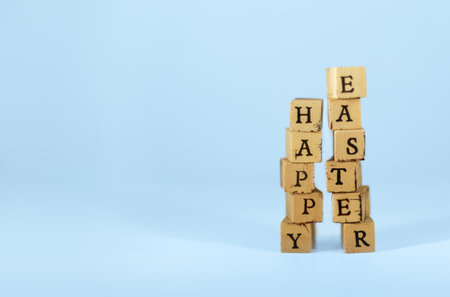 Easter day celebration. Cube calendar with pastel colored background, copy space for graphic resources and vintage text.の写真素材