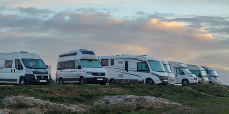 Motorhome parking in the middle of nature at dawn. Mobile house in Castilla la Mancha with windmills. Traveler nomadic lifestyleの写真素材