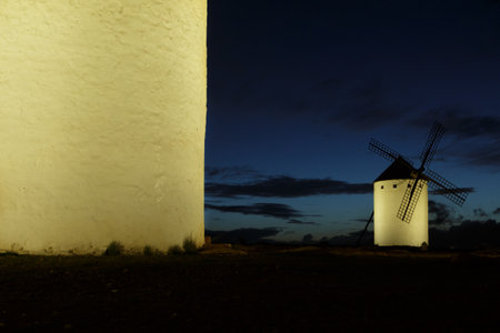 Night photography of illuminated windmills in Campo de Criptana, Ciudad Real. Castilla la Mancha. Don Quixote sceneの写真素材
