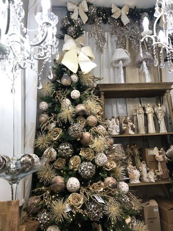 Christmas tree decoration in a small store. Christmas decorations on the shelves.の写真素材