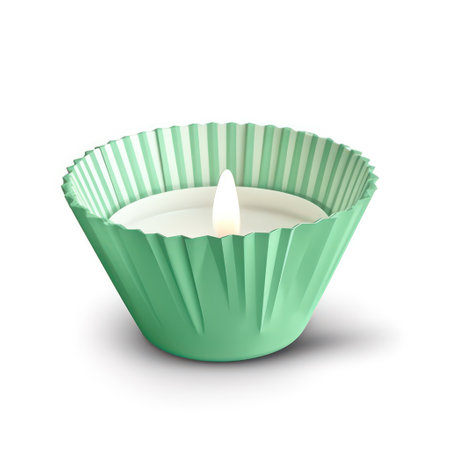 Candle in green paper cupcake holder isolated on white background.の素材