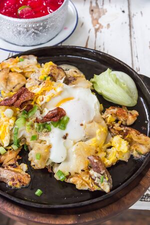 Fried chicken with eggs and noodleの写真素材