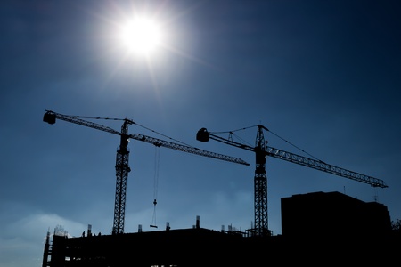 Contemporary skyscrapers and construction site in thailand  Real sun beam の写真素材