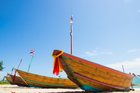 four fishing boat on the beach in thailandの写真素材