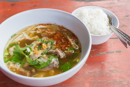 soup entrails pig with rice on woodの写真素材