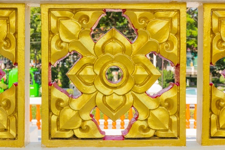Thai style carved wall in thailandの写真素材