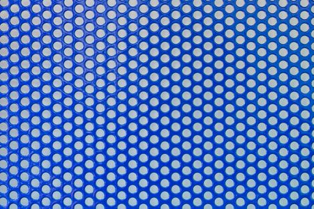 Sheet metal with a grid of circles dip blue colorの写真素材