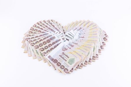 Banknotes of 1000 Thai Baht on white backgroundの写真素材