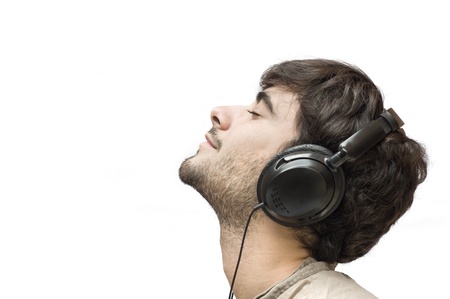Profile of a man with ear-phones isolated on white  の写真素材