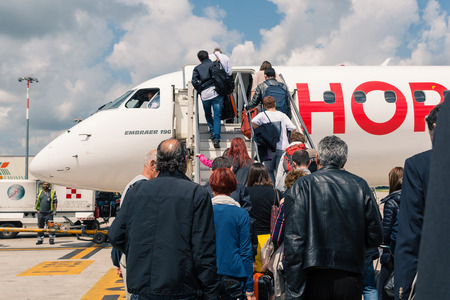 BOLOGNA, ITALY - MAY 13, 2014  Boarding Air France Hop Jet airplane at Bologna airport  The airport is named after Bologna native G  Marconi, an Italian electrical engineer and Nobel laureate のeditorial素材