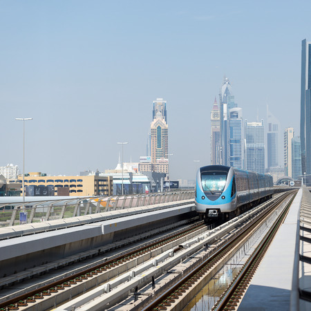 DUBAI, UAE - MARCH 28, 2014  Train approaching Jumeirah Lakes Tower metro station  のeditorial素材
