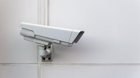 isolated Security Camera on a wall 