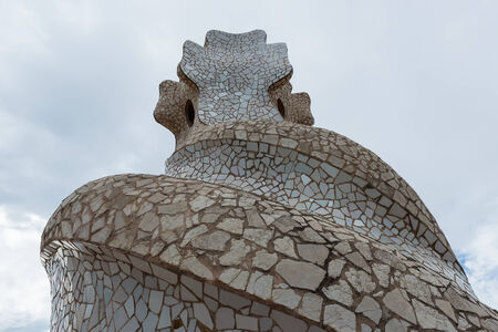 BARCELONA, SPAIN - MAY 31, 2014: Chimney on rooftop of Gaudi's masterpiece Casa Batlo. The building that is now Casa Batllo was built in 1877 by Antoni Gaudi, commissioned by Lluis Sala Sanchez.のeditorial素材